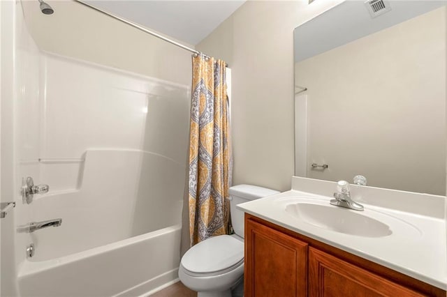 full bathroom with shower / bath combo with shower curtain, vanity, and toilet