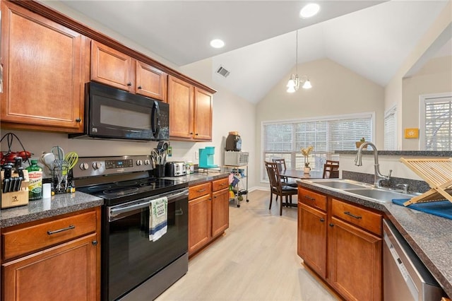 kitchen with appliances with stainless steel finishes, light hardwood / wood-style flooring, a wealth of natural light, and sink