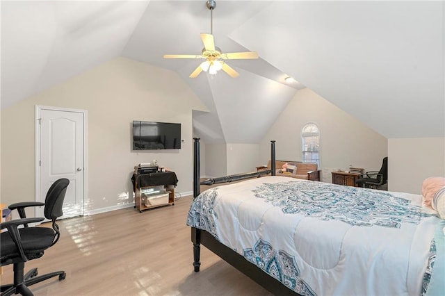 bedroom featuring ceiling fan, light hardwood / wood-style flooring, and lofted ceiling