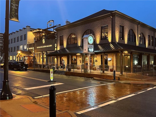 view of outdoor building at dusk