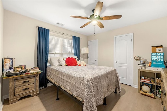 bedroom featuring ceiling fan and light hardwood / wood-style flooring