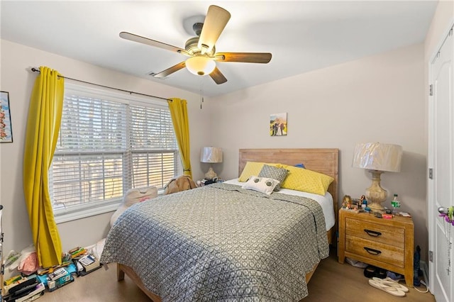 carpeted bedroom with ceiling fan