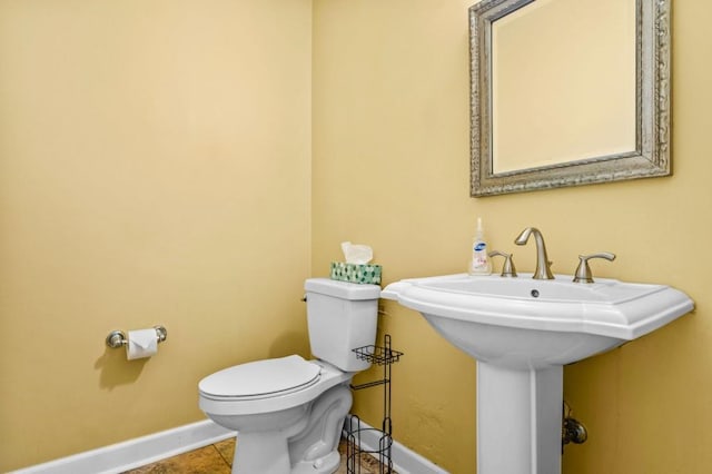 2610 Chadwick Rd, Marietta, GA 30066 - half bath featuring baseboards, toilet, and tile patterned flooring