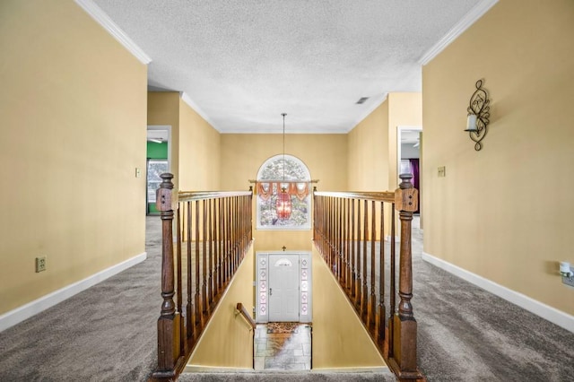 2610 Chadwick Rd, Marietta, GA 30066 - hall featuring an upstairs landing, carpet, baseboards, crown molding, and a textured ceiling