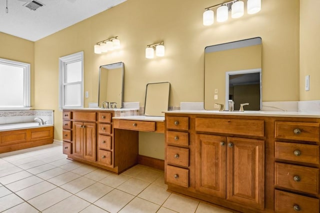 2610 Chadwick Rd, Marietta, GA 30066 - bathroom featuring tile patterned floors, vanity, and a bath