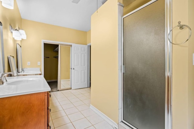 2610 Chadwick Rd, Marietta, GA 30066 - full bathroom featuring double vanity, a stall shower, tile patterned flooring, and baseboards