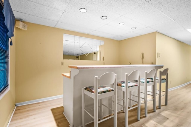 2610 Chadwick Rd, Marietta, GA 30066 - bar area featuring baseboards, wood finished floors, and a drop ceiling