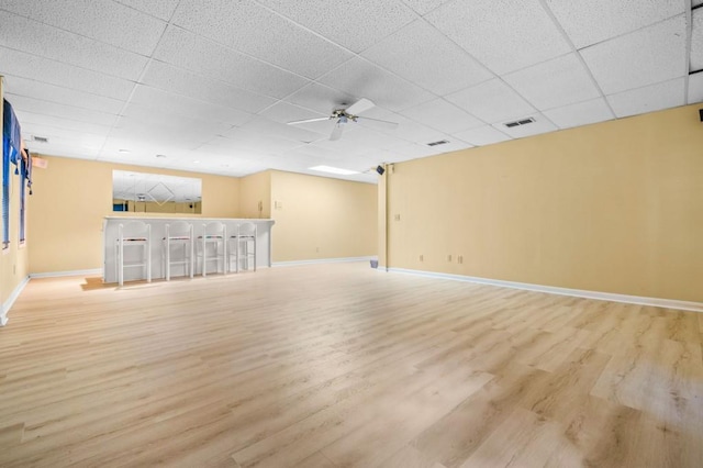2610 Chadwick Rd, Marietta, GA 30066 - unfurnished living room with light wood-style floors, ceiling fan, baseboards, and a paneled ceiling