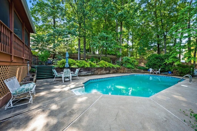 2610 Chadwick Rd, Marietta, GA 30066 - view of swimming pool with a fenced backyard, a patio, and view of scattered trees