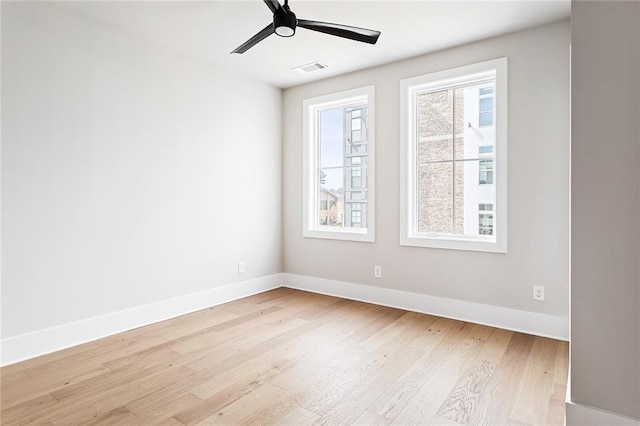 7210 Summit Pl, Alpharetta, GA 30009 - empty room featuring light wood finished floors, baseboards, and a ceiling fan
