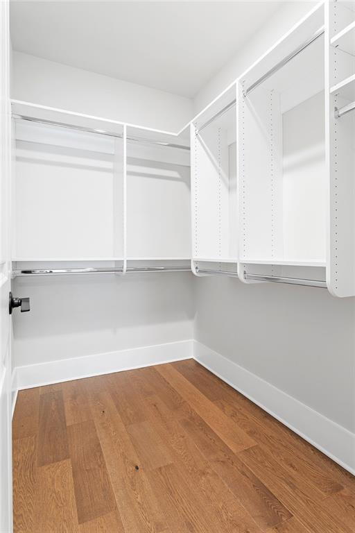 7210 Summit Pl, Alpharetta, GA 30009 - walk in closet with wood finished floors