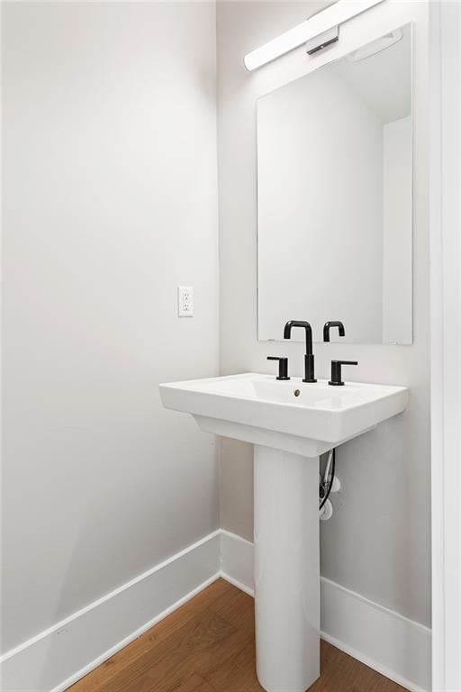 7210 Summit Pl, Alpharetta, GA 30009 - bathroom featuring baseboards, wood finished floors, and a sink