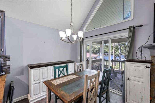 dining area featuring a notable chandelier and dark hardwood / wood-style floors