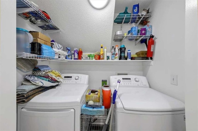 clothes washing area with washing machine and clothes dryer