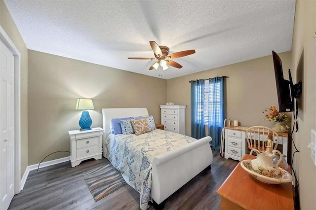 bedroom featuring dark hardwood / wood-style flooring, a closet, a textured ceiling, and ceiling fan