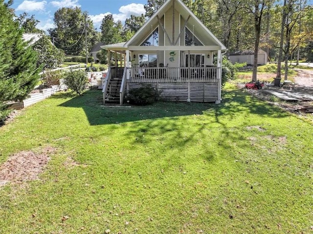 back of property featuring a yard and a storage shed