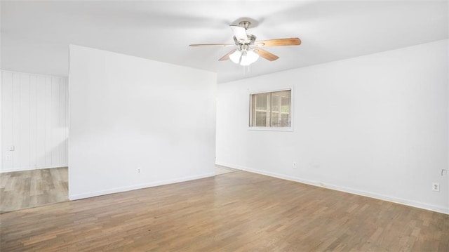 empty room featuring ceiling fan and wood-type flooring