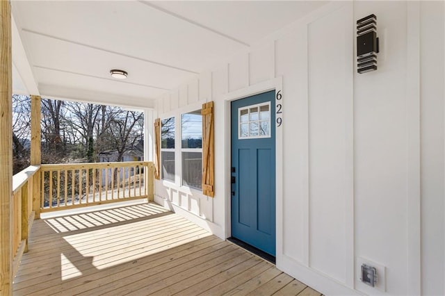 wooden terrace with a porch