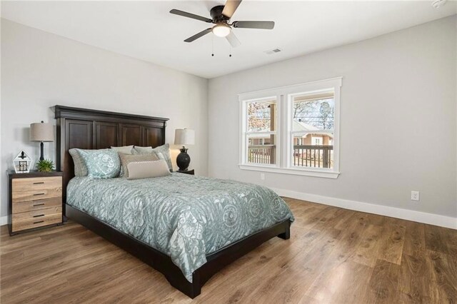 unfurnished living room featuring sink and hardwood / wood-style floors