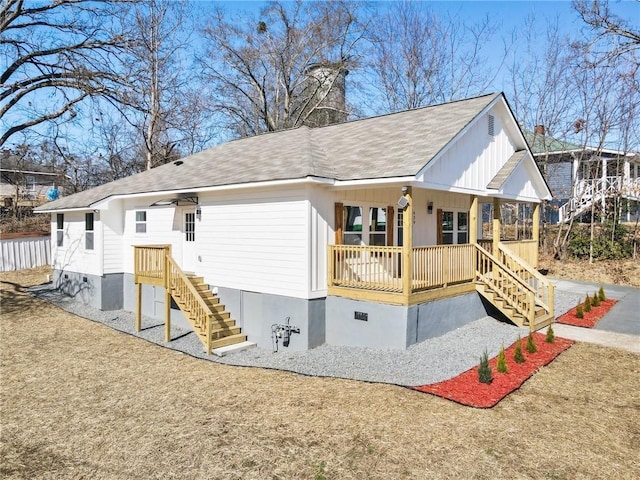 rear view of house with crawl space and a porch