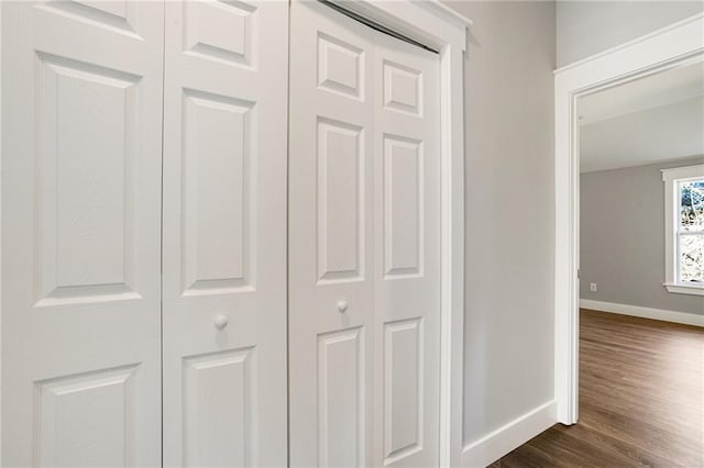 interior details featuring wood finished floors and baseboards