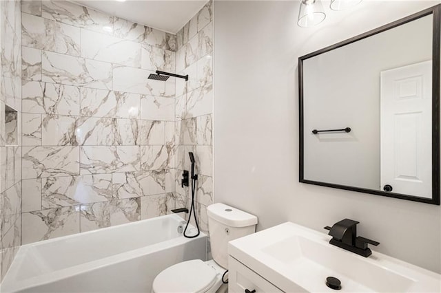 full bathroom featuring tiled shower / bath, vanity, and toilet