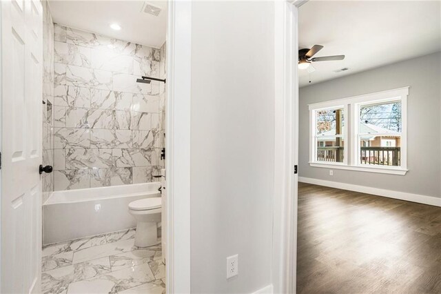 empty room featuring hardwood / wood-style flooring and ceiling fan