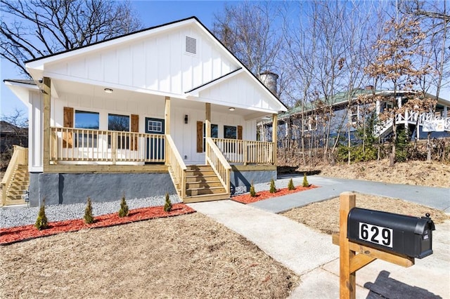 view of front facade featuring a porch and board and batten siding