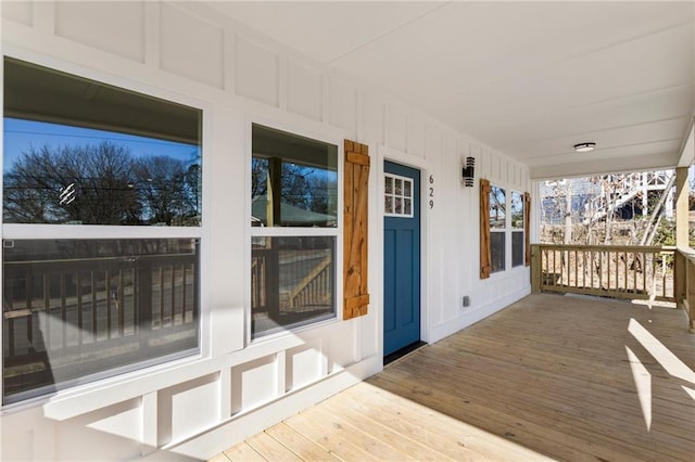 wooden terrace featuring a porch