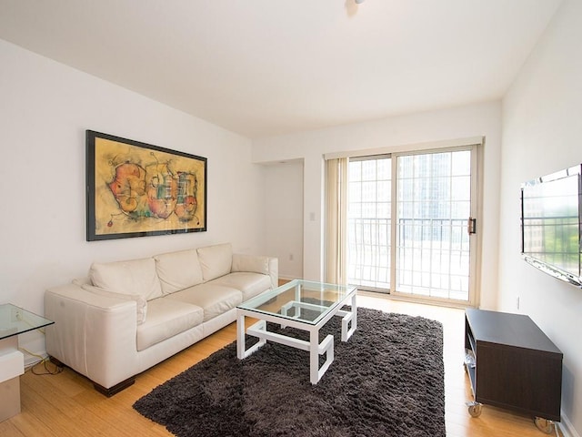199 14th St NE Unit 1209, Atlanta, GA 30309 - living room with light wood finished floors