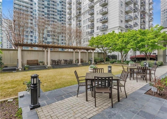 199 14th St NE Unit 1209, Atlanta, GA 30309 - view of patio with a pergola and outdoor dining space