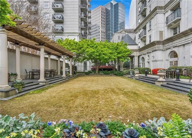 199 14th St NE Unit 1209, Atlanta, GA 30309 - surrounding community with a pergola and a lawn
