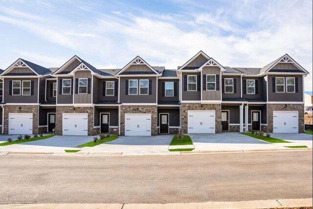 235 Ivey Ter, Temple, GA 30179 - multi unit property featuring an attached garage, driveway, and board and batten siding