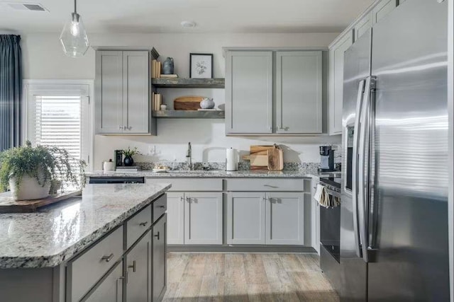 235 Ivey Ter, Temple, GA 30179 - kitchen featuring stainless steel fridge with ice dispenser, open shelves, gray cabinetry, a sink, and light stone counters