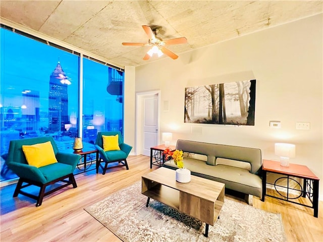 400 W Peachtree St NW Unit 2704, Atlanta, GA 30308 - living room featuring wood finished floors, ceiling fan, and a wall of windows