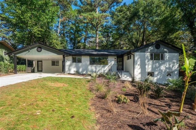 ranch-style home with a carport and a front lawn