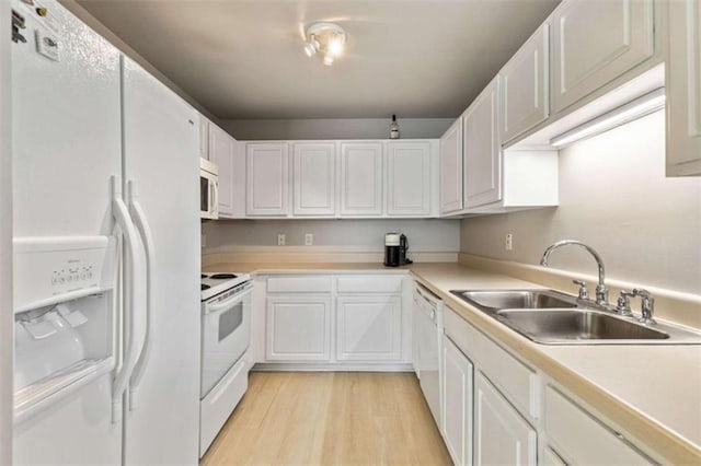 50 Emerald Hills Ln, Newnan, GA 30263 - kitchen featuring a sink, white cabinetry, white appliances, and light countertops