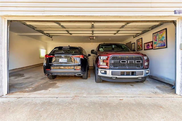 50 Emerald Hills Ln, Newnan, GA 30263 - garage with concrete driveway and a garage door opener