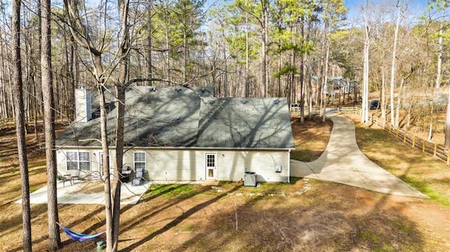 50 Emerald Hills Ln, Newnan, GA 30263 - view of front of home with fence, a patio, and a chimney