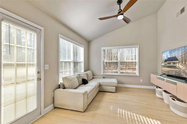 50 Emerald Hills Ln, Newnan, GA 30263 - living room featuring ceiling fan, light wood-style floors, baseboards, lofted ceiling, and visible vents