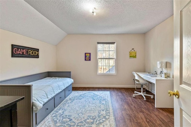 50 Emerald Hills Ln, Newnan, GA 30263 - bedroom with baseboards, vaulted ceiling, dark wood-style floors, and a textured ceiling
