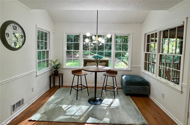 1461 Fox Forest Ter SW, Lilburn, GA 30047 - sunroom / solarium with a chandelier and vaulted ceiling