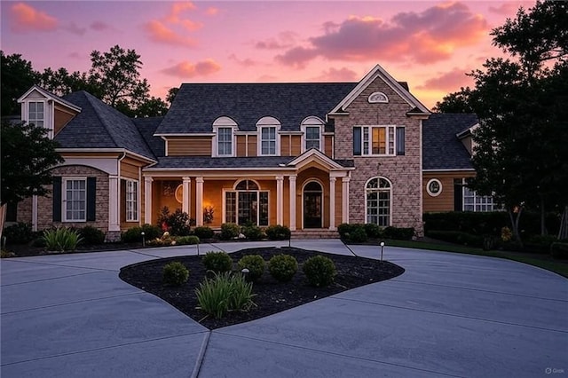 6225 Random Winds Blf, Gainesville, GA 30506 - view of front of property with stone siding, curved driveway, and covered porch