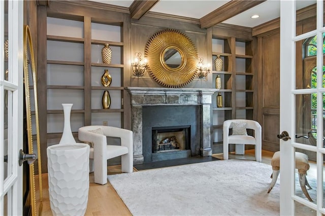 6225 Random Winds Blf, Gainesville, GA 30506 - sitting room featuring french doors, wood finished floors, a premium fireplace, beamed ceiling, and built in shelves