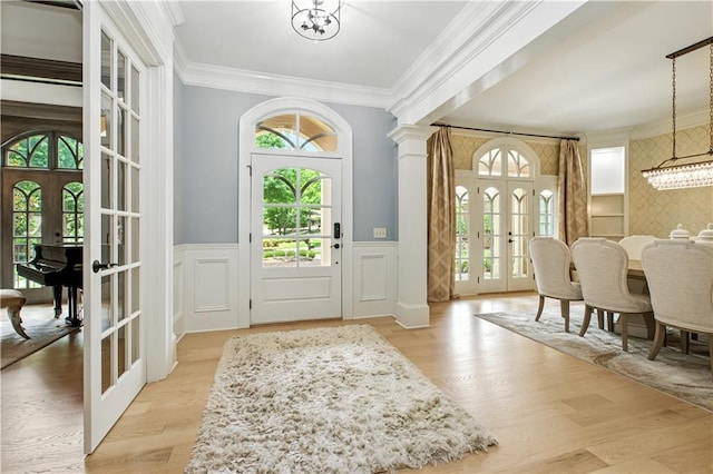 6225 Random Winds Blf, Gainesville, GA 30506 - entrance foyer featuring french doors, crown molding, a wainscoted wall, a decorative wall, and a chandelier