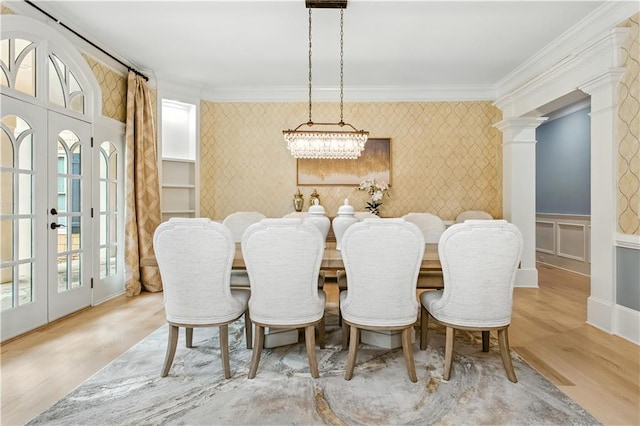 6225 Random Winds Blf, Gainesville, GA 30506 - dining space with wallpapered walls, ornamental molding, an accent wall, light wood-type flooring, and a chandelier