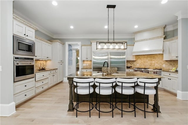6225 Random Winds Blf, Gainesville, GA 30506 - kitchen featuring built in appliances, light stone countertops, backsplash, crown molding, and recessed lighting