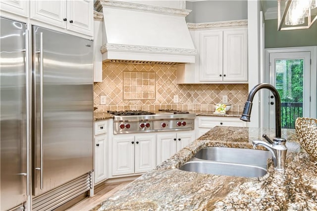 6225 Random Winds Blf, Gainesville, GA 30506 - kitchen featuring stainless steel appliances, premium range hood, white cabinets, and stone counters