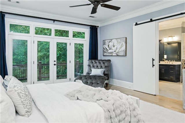 6225 Random Winds Blf, Gainesville, GA 30506 - bedroom with a barn door, light wood finished floors, access to exterior, crown molding, and ensuite bathroom