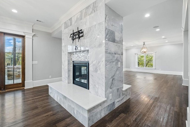 6225 Random Winds Blf, Gainesville, GA 30506 - unfurnished living room featuring a tile fireplace, dark wood-style flooring, crown molding, and recessed lighting